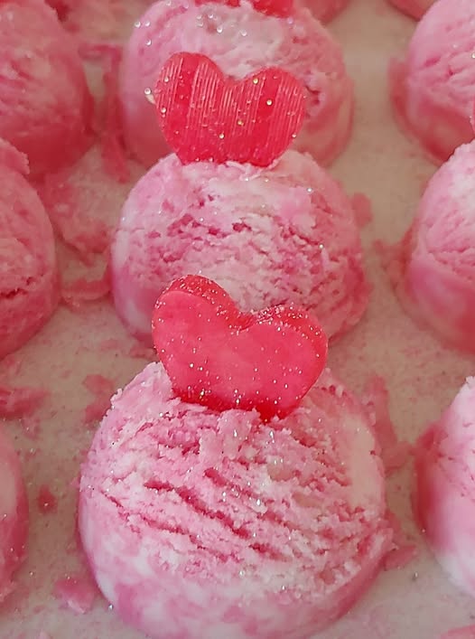 Pink handmade bubble scoops topped with heart embeds and glitter