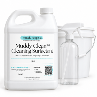 White F-style jug of Muddy Clean Cleaning Surfactant with Muddy Soap Co. label, shown with a clear spray bottle and white bucket on a white background.